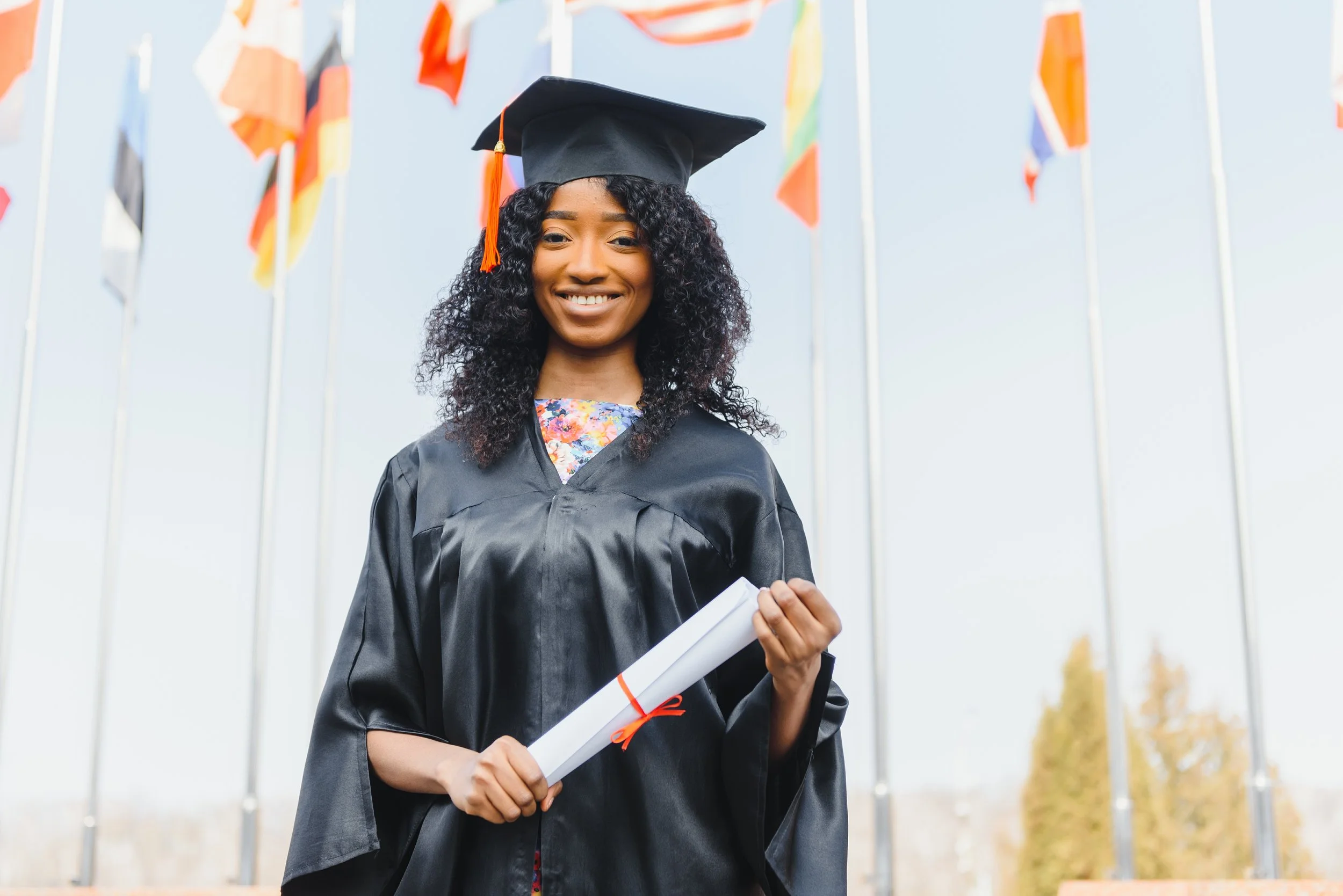 vecteezy_young-female-african-american-student-with-diploma-poses_48806056.jpg