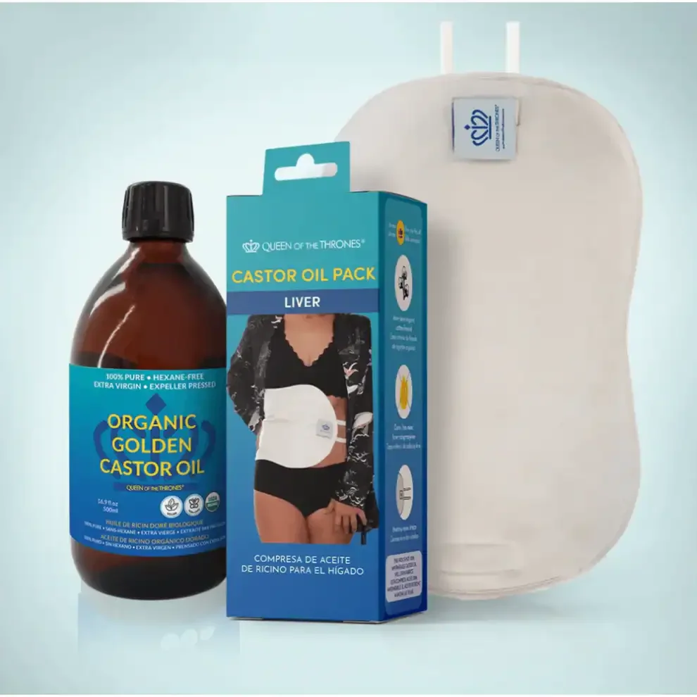 A bottle of organic golden castor oil, a castor oil pack box, and a white castor oil pack for the liver detox.