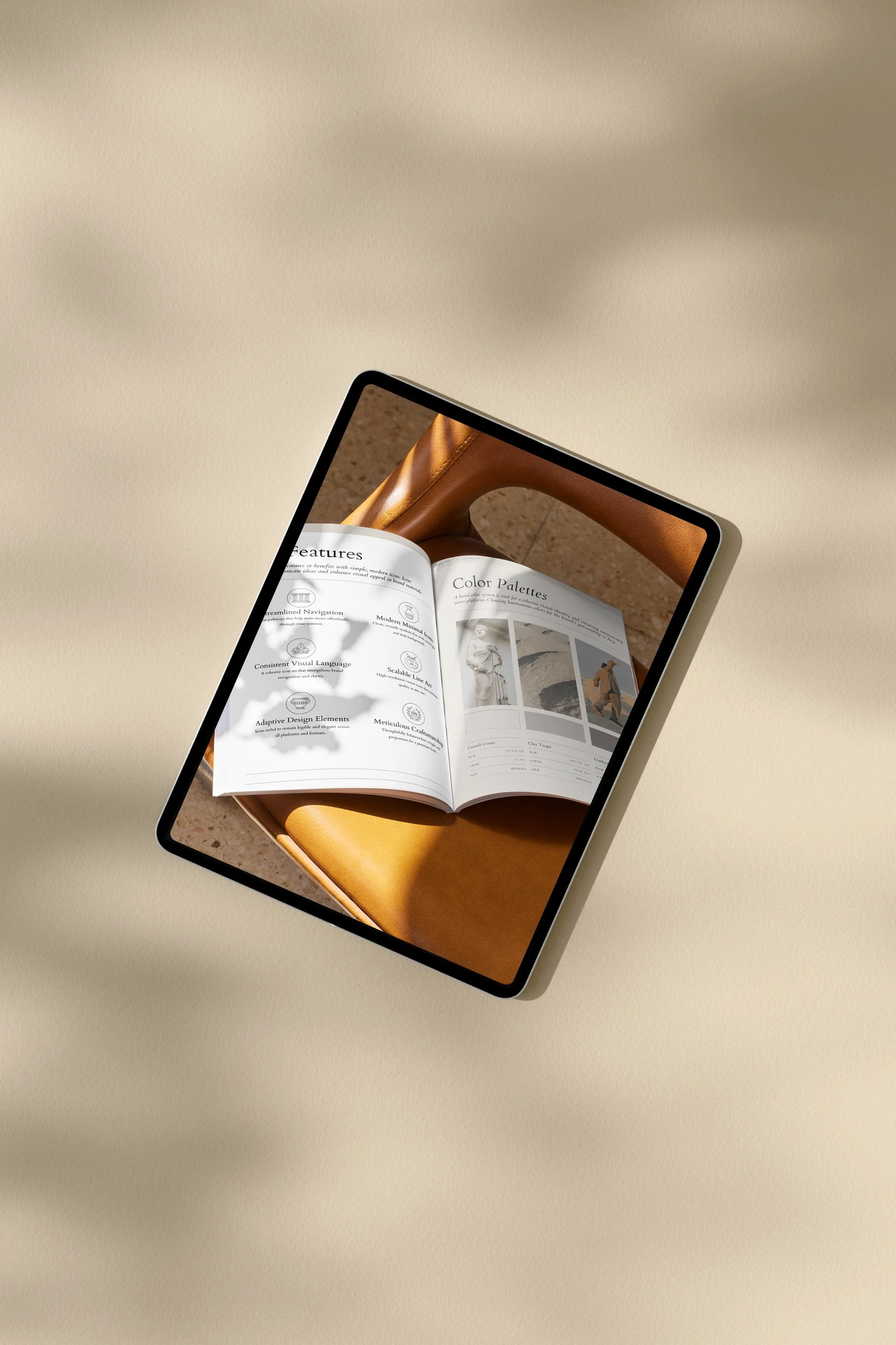 A tablet displaying an open magazine with sections on features and color palettes, resting on a wooden chair.