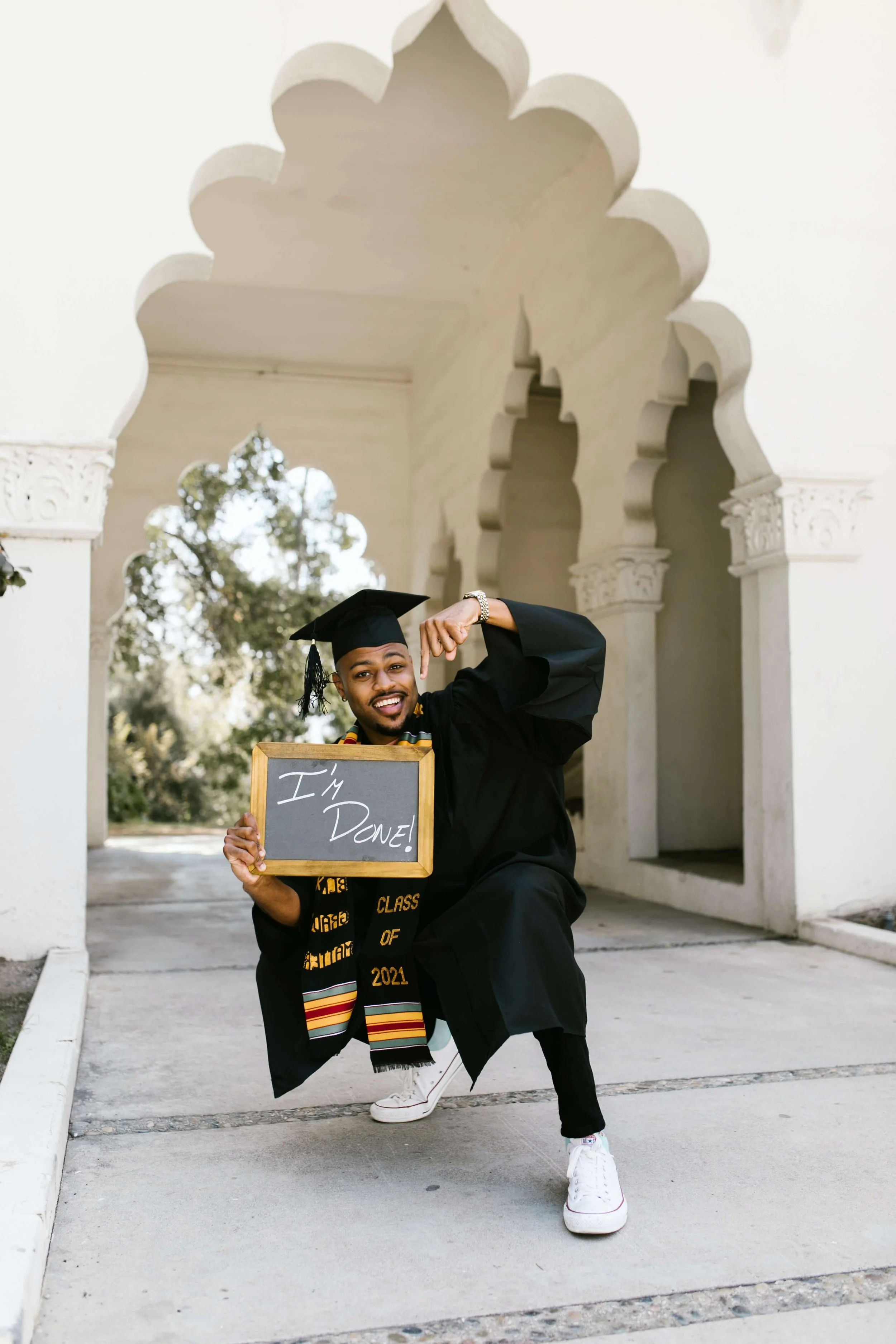 A young man celebrates his graduation from college free of anxiety and fear thanks to the help of Therapy for Anxiety in NYC.