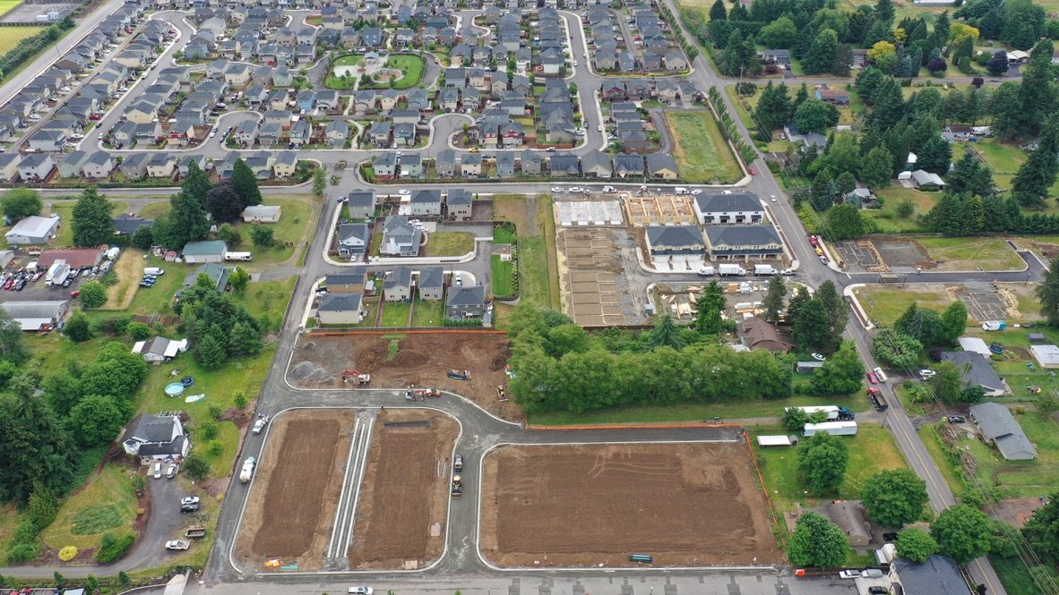 Aerial view of a residential neighborhood with ongoing construction and development.