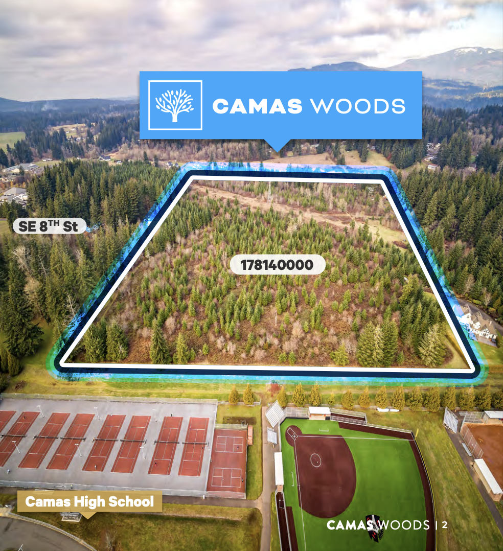 Aerial view of a neighborhood with a forested area outlined in blue and labeled "CAMAS WOODS." Nearby are a high school with tennis courts, a sports field, and surrounding houses. The forest area is marked with the lot number 178140000, and the stree