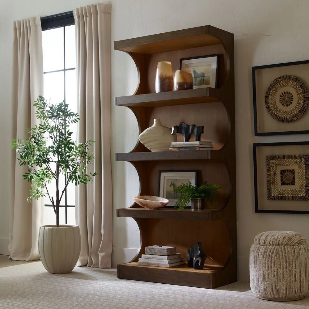 Statement design made simple. The Osrick Etagere brings elegant curves and classic warmth to any interior.  Contact us to learn more (850) 232-4810