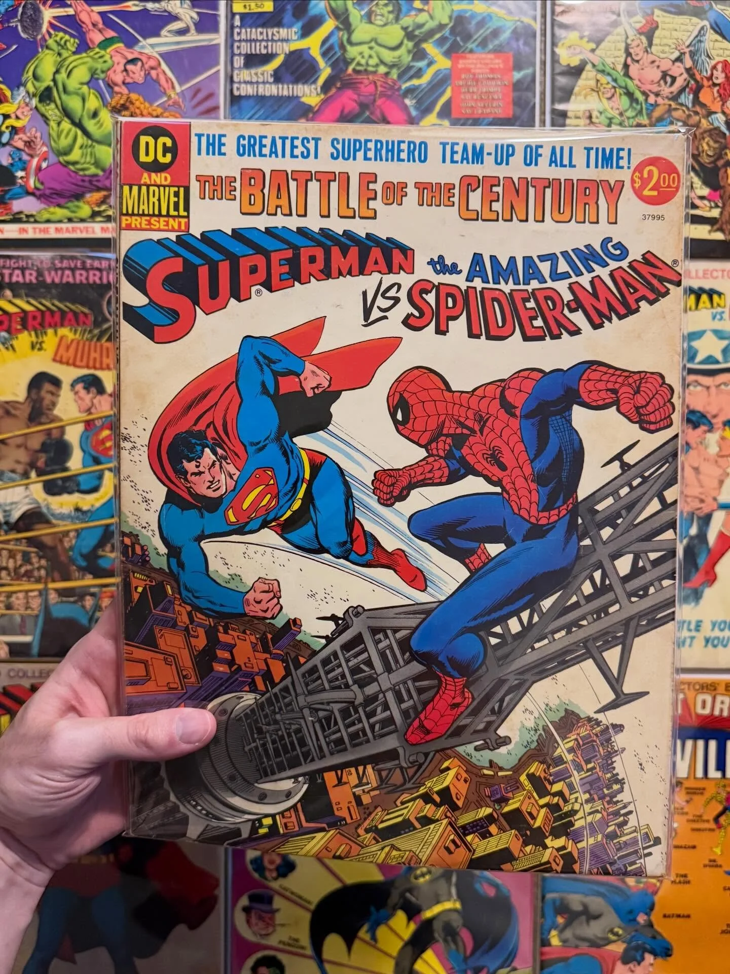 Just bought a small collection of treasuries that had this Superman vs. Spider-Man in it from 1975! The first crossover of Marvel &amp; DC characters! 🔑😍

Lots of fun treasuries in here including the Superman vs Muhammad Ali (sadly cover is detache