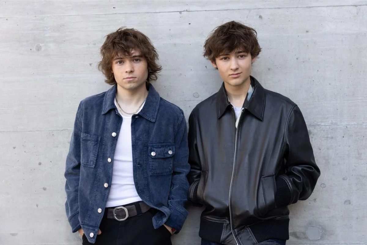 Rocco & Frankie standing against wall