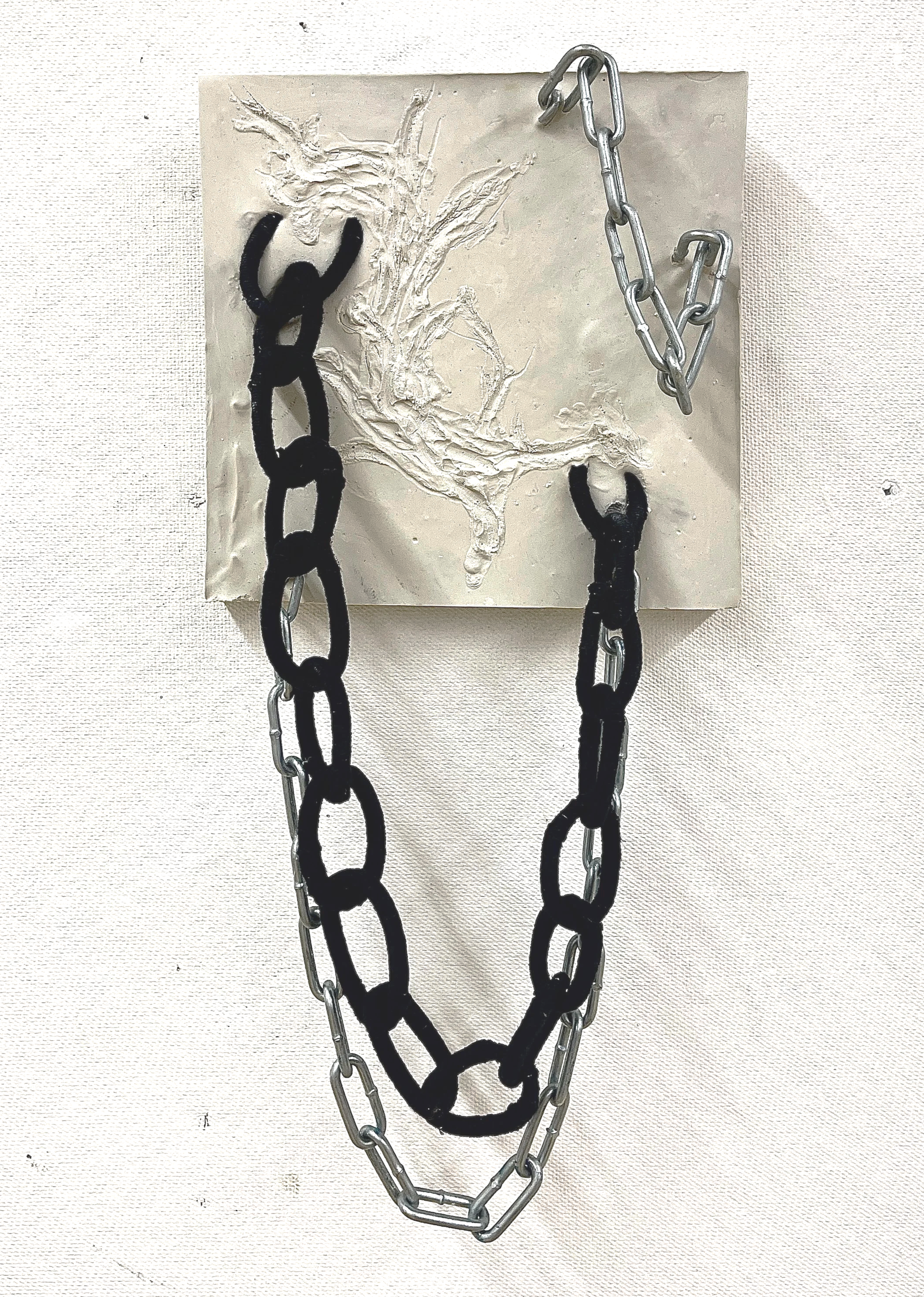 "Bound." Plaster, Yarn, Chain. 16x8". 2022