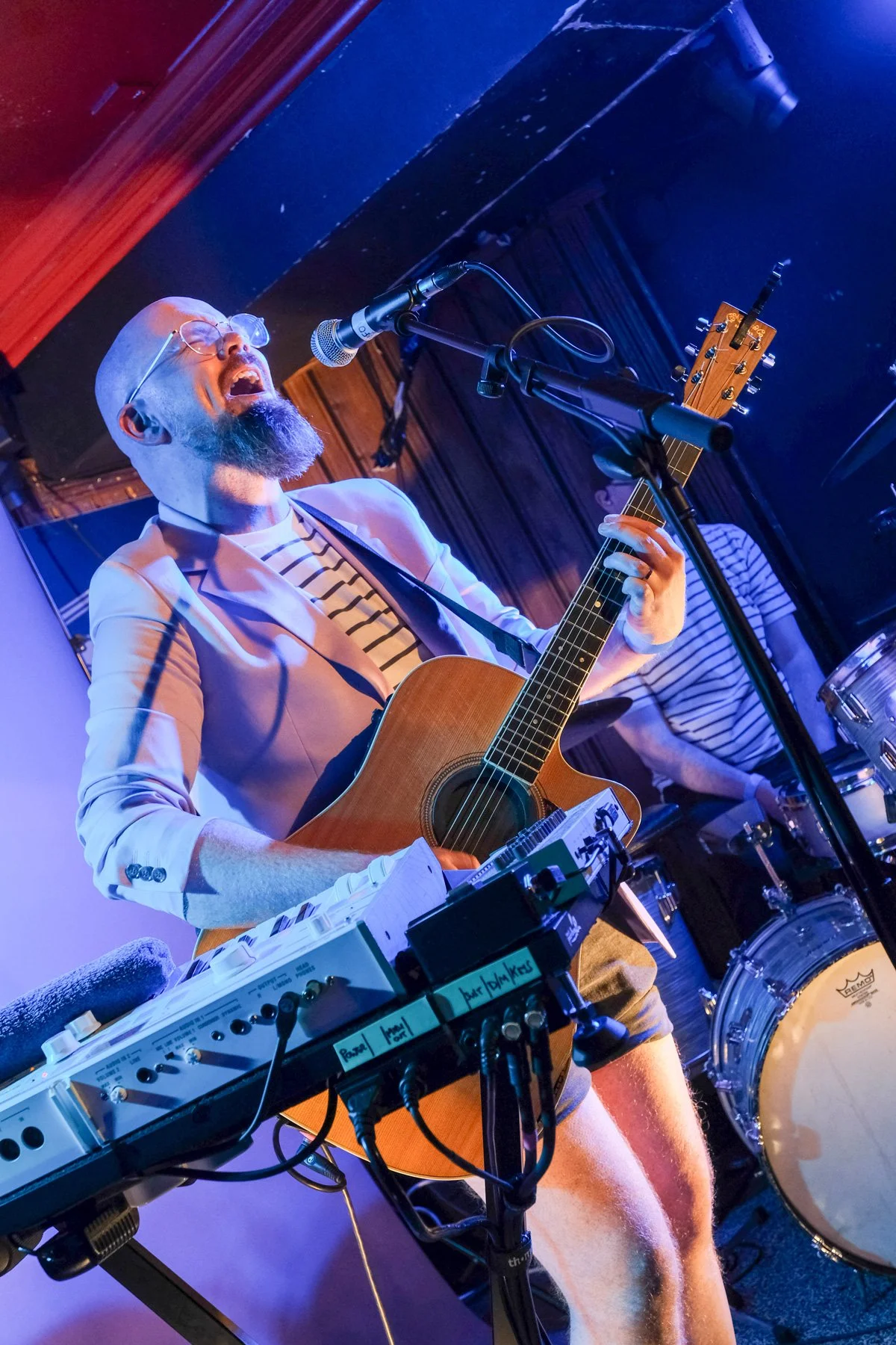 Mr Billy Fitzgerald performing with guitar on stage