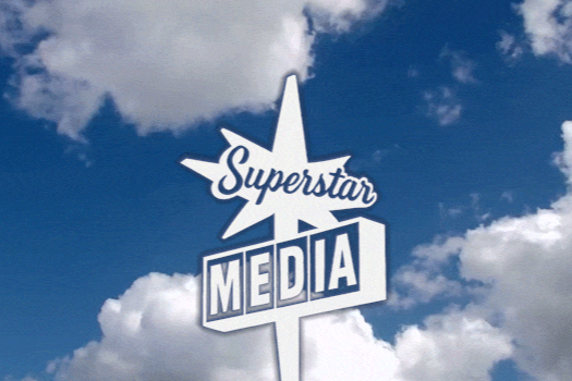 Sign with the text 'Superstar Media' against a background of blue sky with clouds.