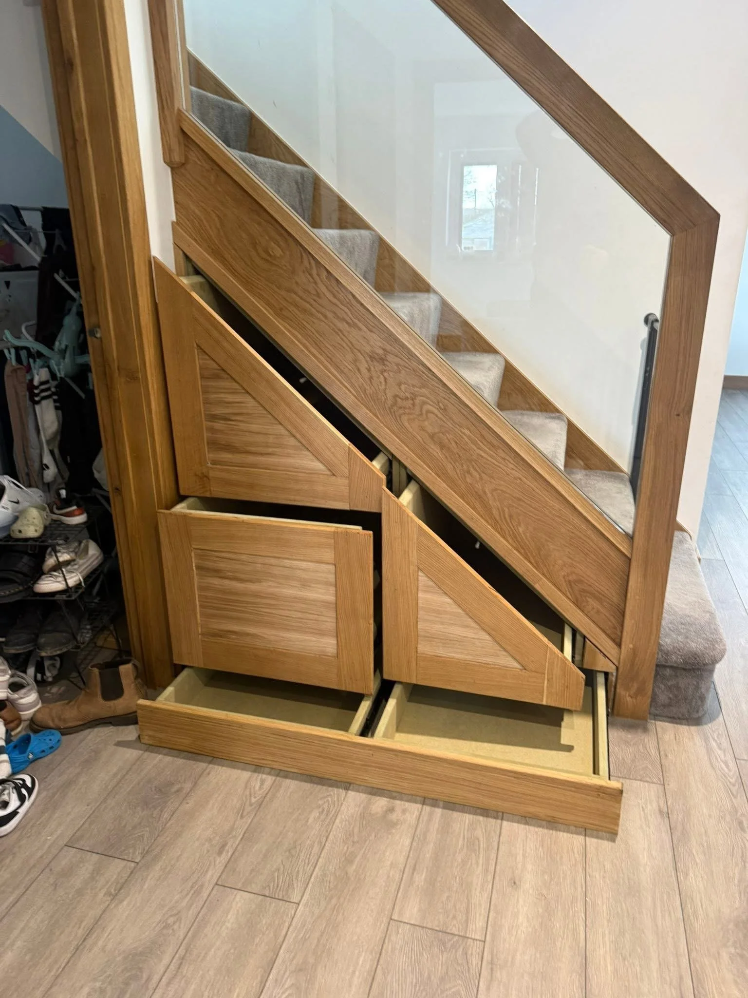 Close-up of bespoke oak under-stair drawers