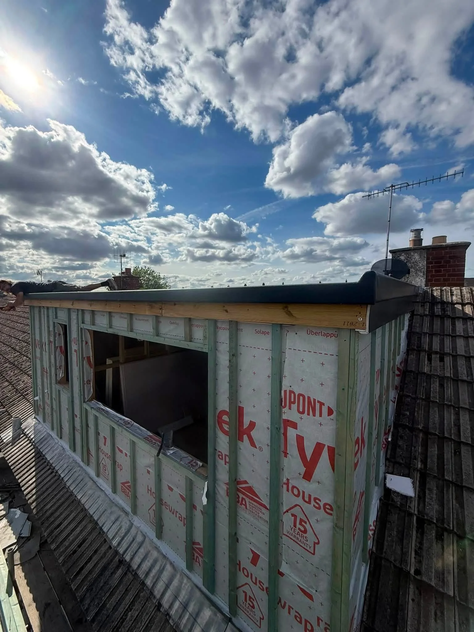 Timber-framed dormer extension wrapped in breather membrane