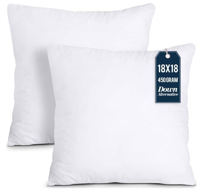 Two white pillows with a tag indicating they are 18x18 inches, 450 grams, down alternative filling.