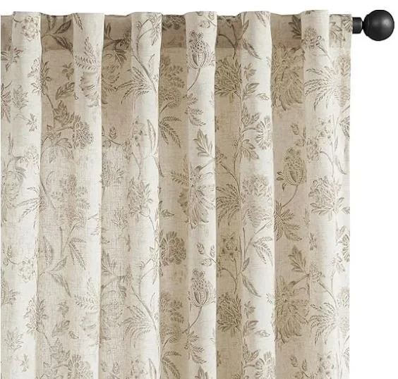 Interior design inspiration featuring a stylish and shoppable Cream-colored curtains with a subtle floral and foliage pattern hanging on a rod.
