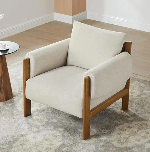 Interior design Inspiration featuring a stylish shoppable beige armchair with wooden armrests and legs in a room with light-colored walls and carpet.