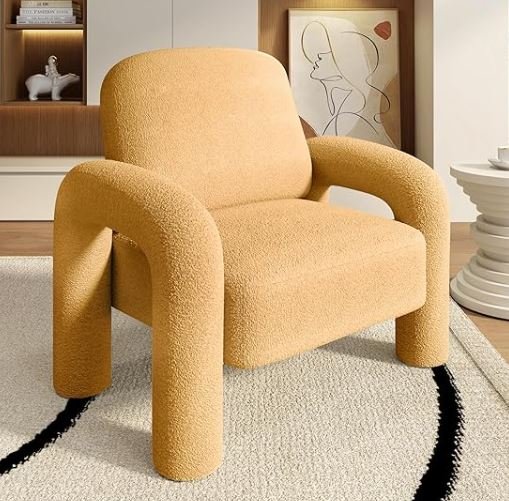 Interior design Inspiration featuring a stylish shoppable yellow upholstered armchair in a modern living room with a framed abstract line art drawing and a white side table.