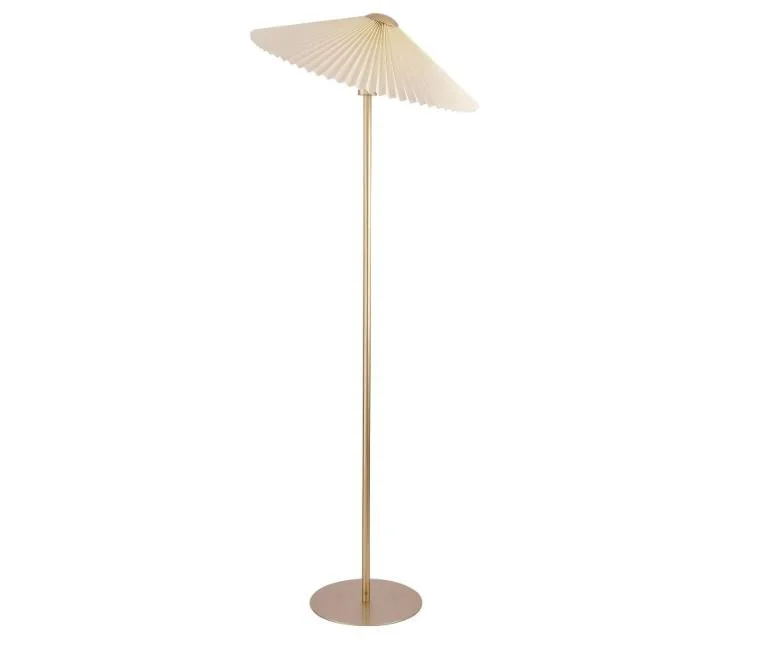 Interior design Inspiration featuring a stylish shoppable modern floor lamp with a round base, a tall slim pole, and a large, cream-colored umbrella-shaped shade.