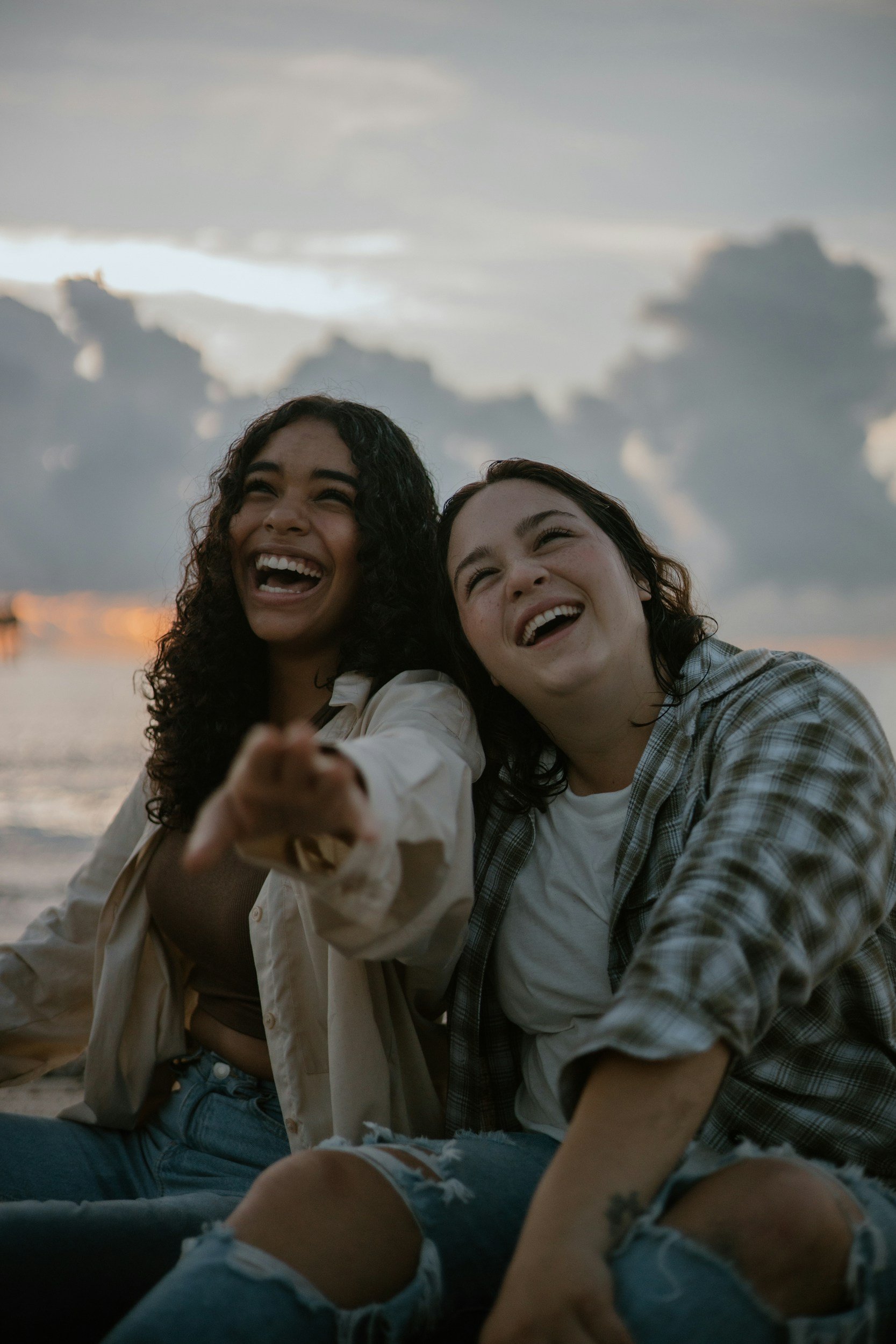 Two people sharing a relaxed conversation, representing connection and the hope of feeling more at ease through anxiety therapy.