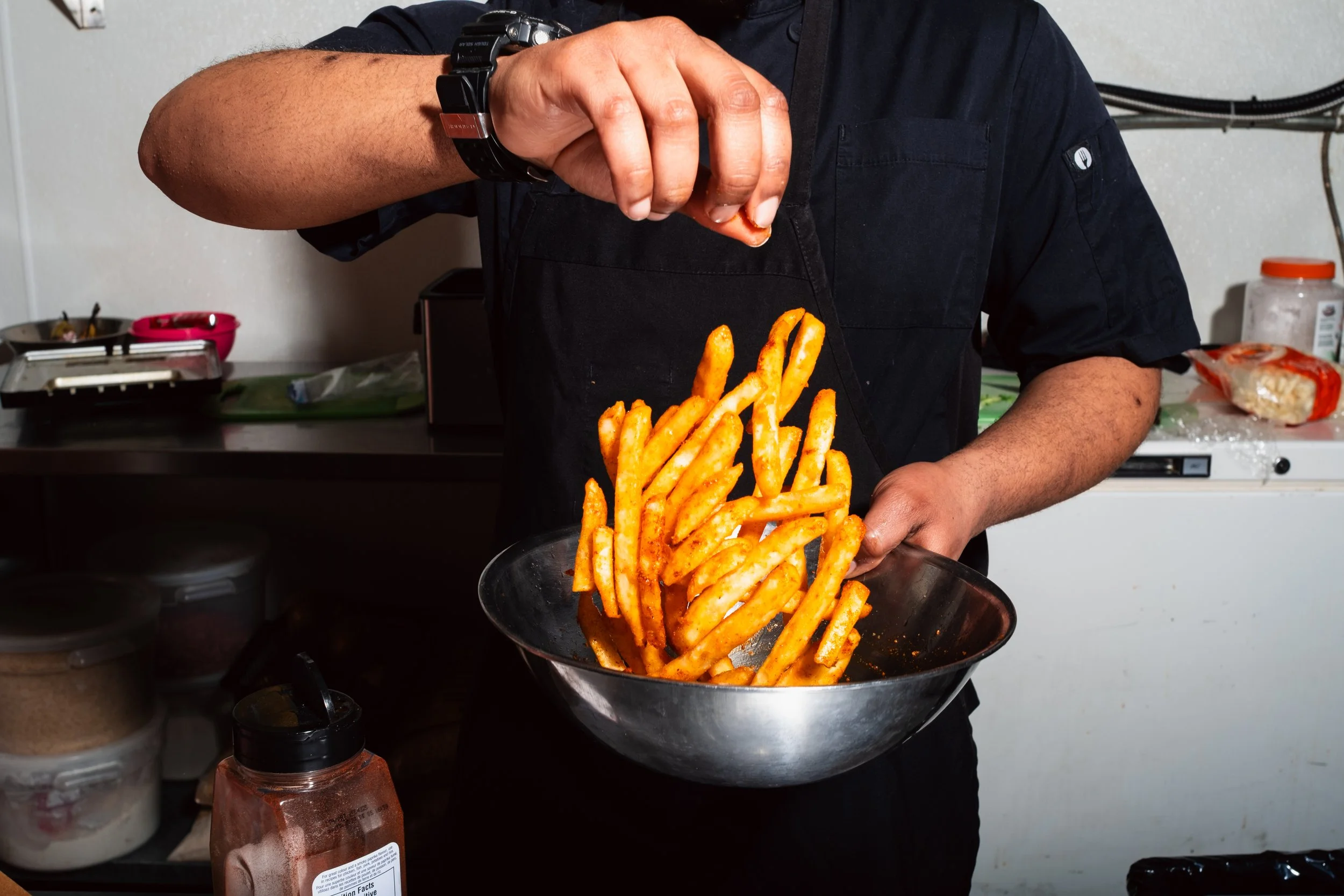 Photographer: Zachery Knudson. Fries Toss. Business Banding Photography For King Solomon's Kitchen in Calgary AB