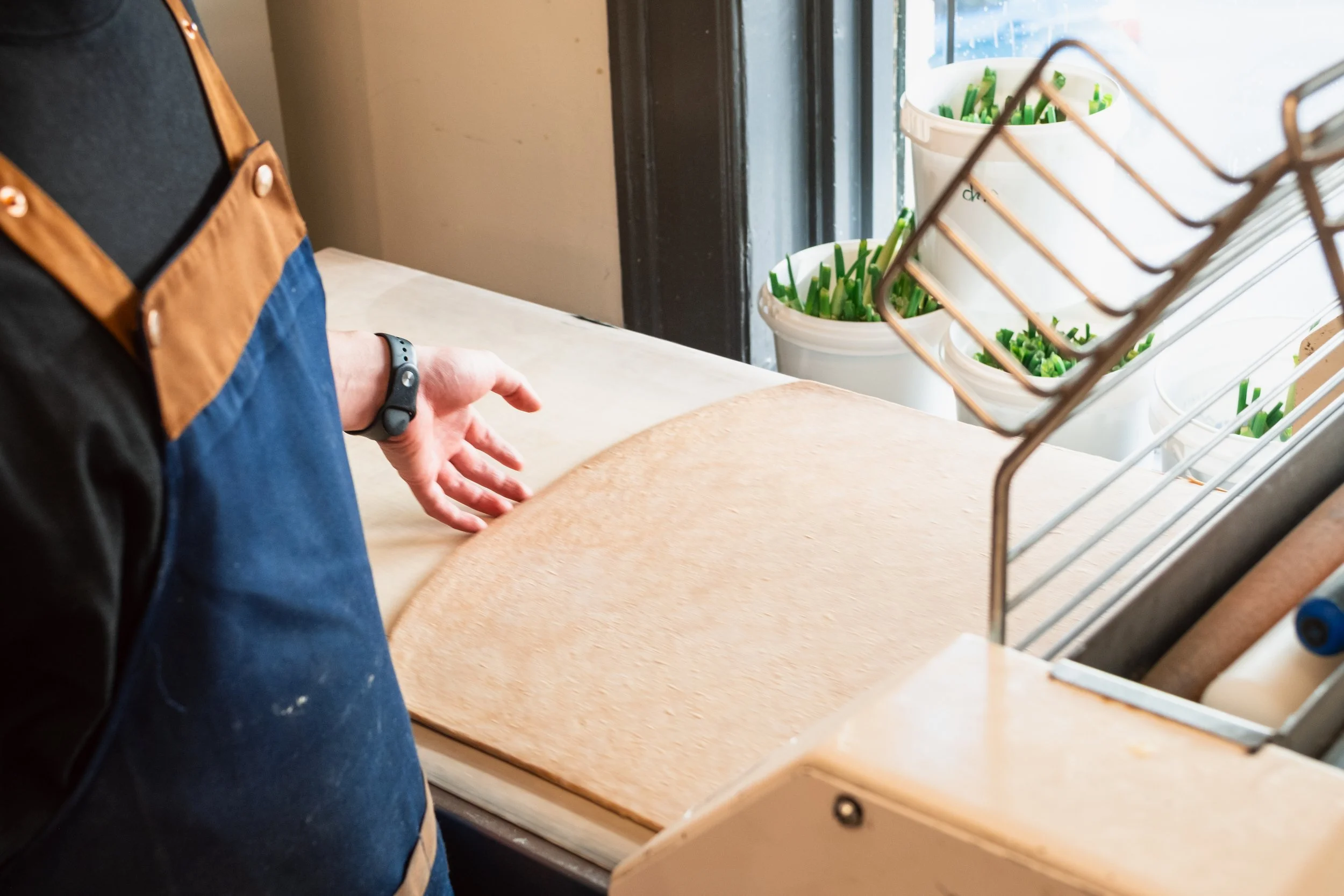 Sheeting Laminated Croissant Dough at Butterblock & Co in Calgary, AB. Photograph by Zachery Knudson. All rights reserved.