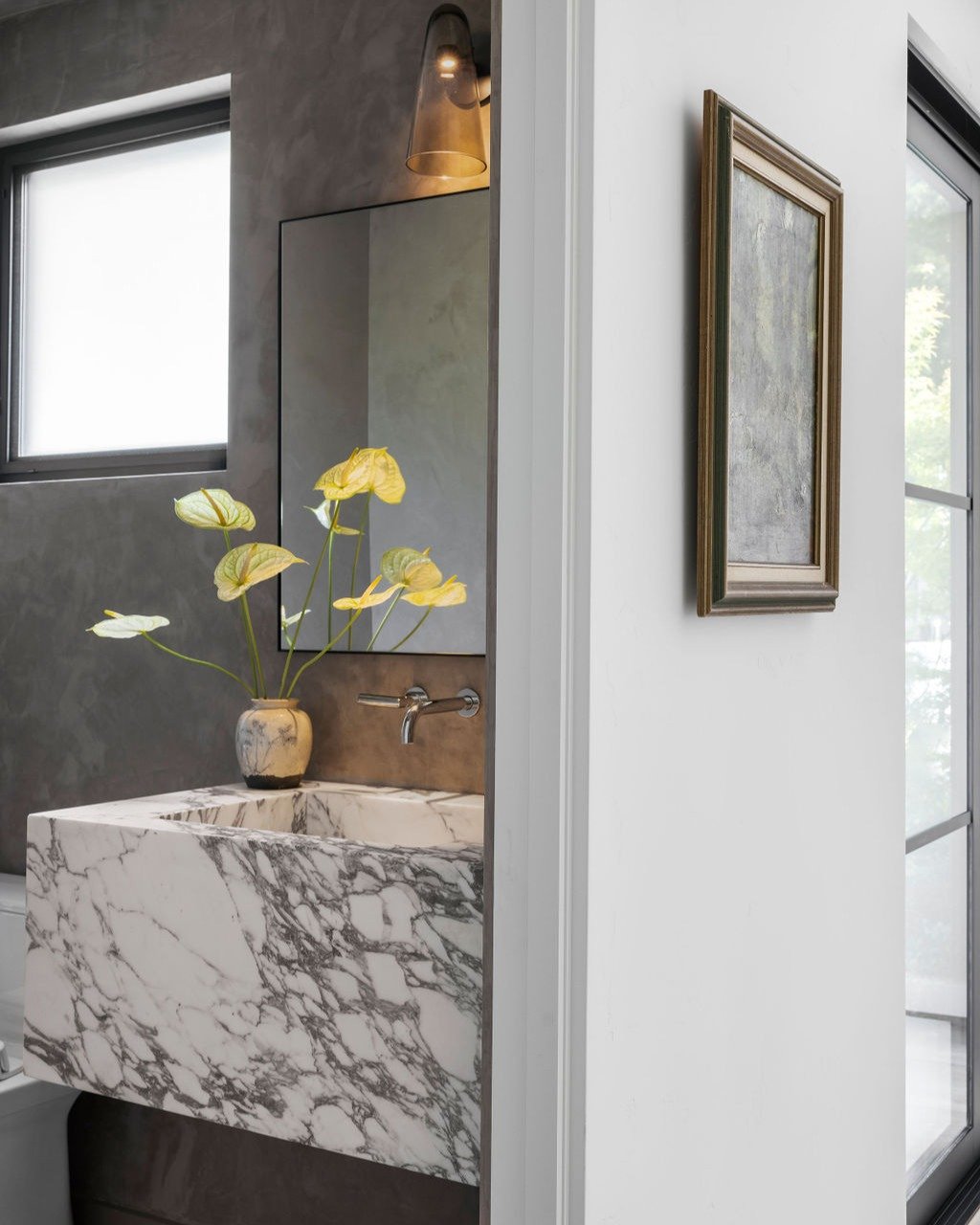 We&rsquo;re currently designing several powder baths and wanted to look back on some previous projects for inspo. In this bathroom the custom stone sink was the focal point. It is simple, but chic!