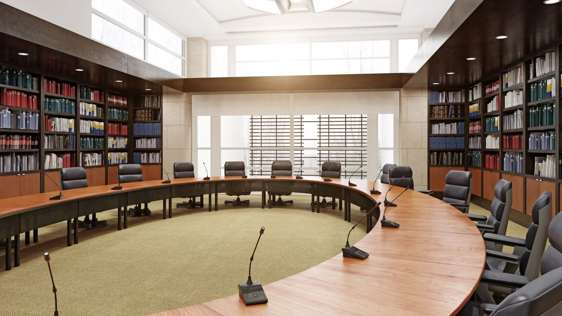 Washington municipal council chambers with curved dais, microphones, and floor-to-ceiling law library