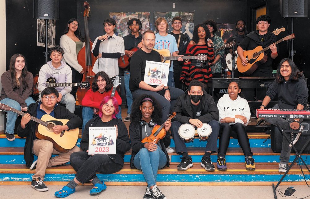 Markus Illko with a large group of student musicians