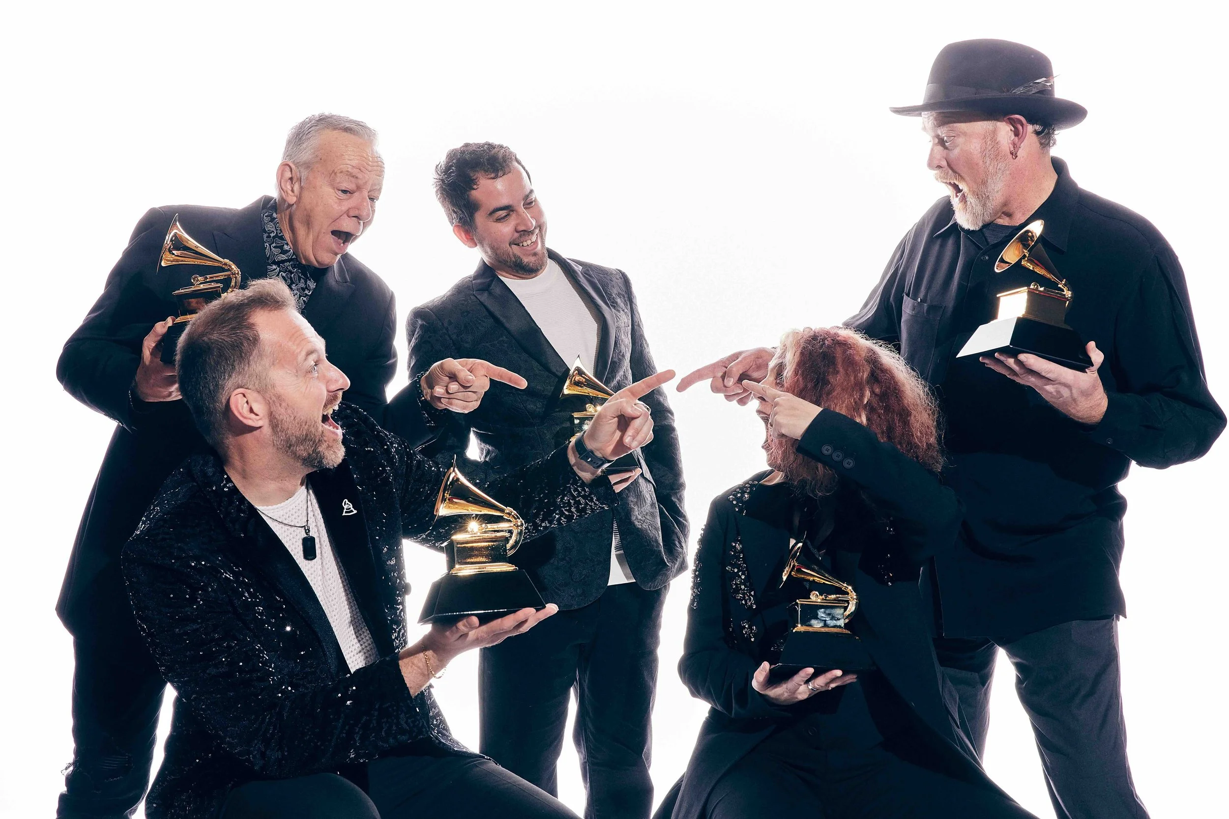 Markus Illko with Tommy Emmanuel, Janet Robin, Roberto Luis Rodriguez and John Carter Cash holding their Grammy Award