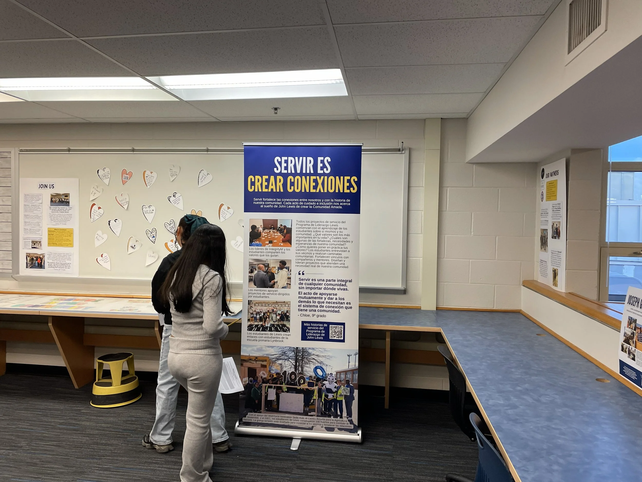  Students explore the Spanish-language panel focused on the theme of connection 