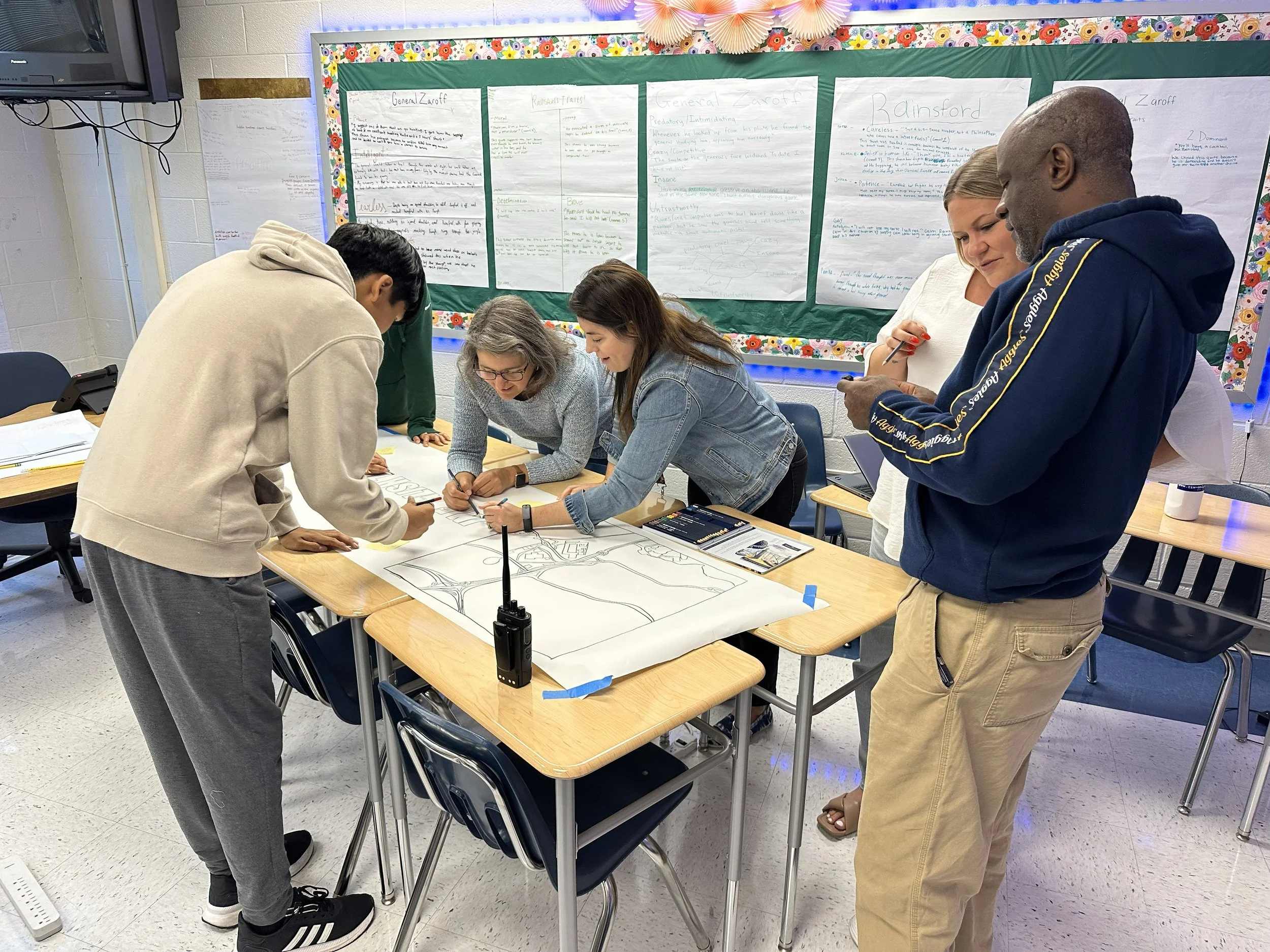 Students and Lewis English teachers had two-way interviews about personal experiences with service and then created a banner for the museum.