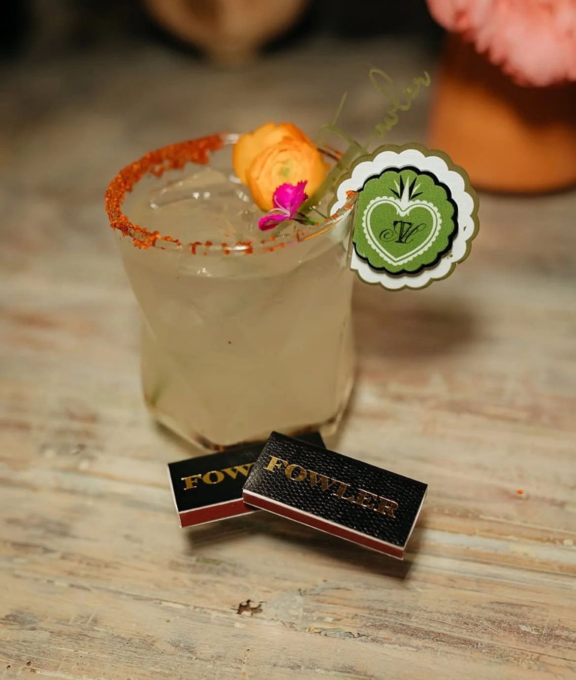 A cocktail glass with a decorative tag. Drink Charm, Cocktail charm, Cute cocktail accessories 