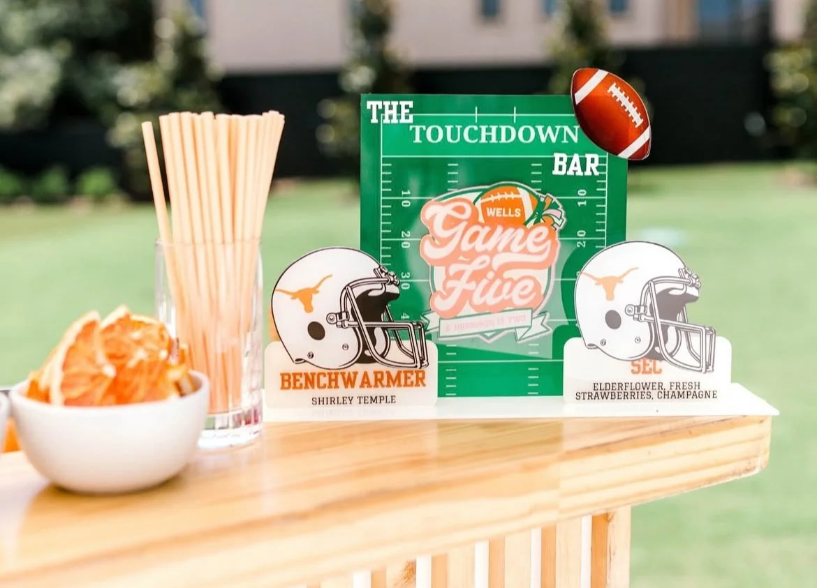 A football-themed table setting, table top sign, custom table top signage