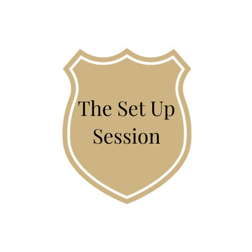 A shield-shaped beige badge with gold outline and black text that reads "The Set Up Session".