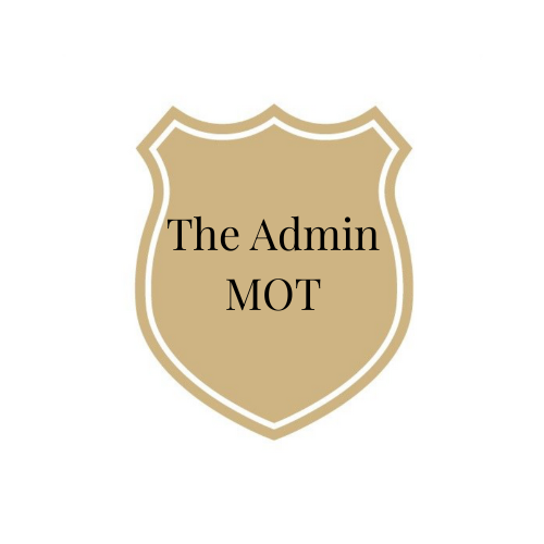 A shield emblem with a gold and tan border and background, with the text 'The Admin MOT' in black in the center.