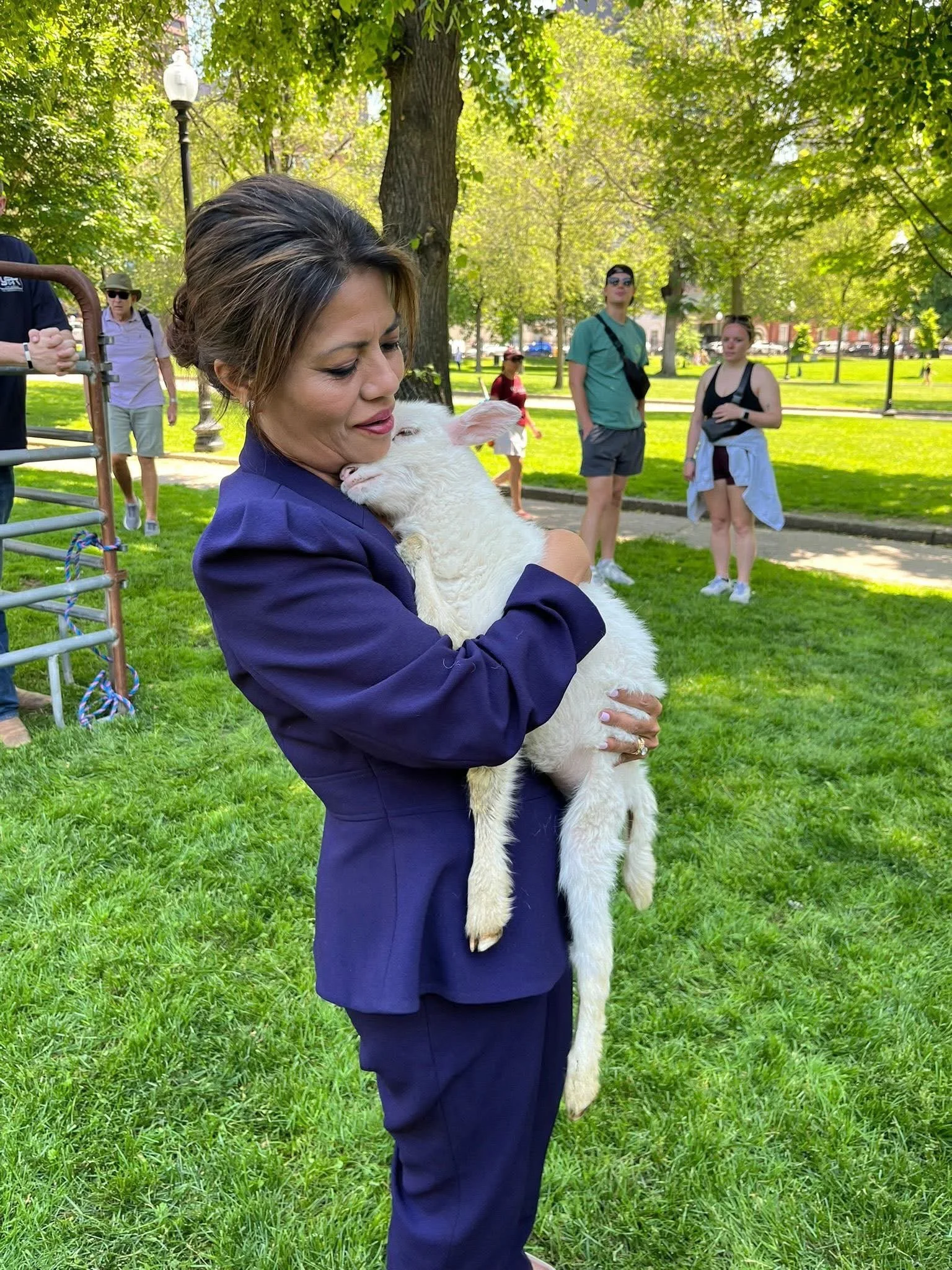Vanna Howard holding a baby goat.