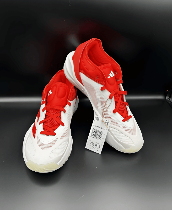 Red and white athletic sneakers with lace-up style for everyday footwear