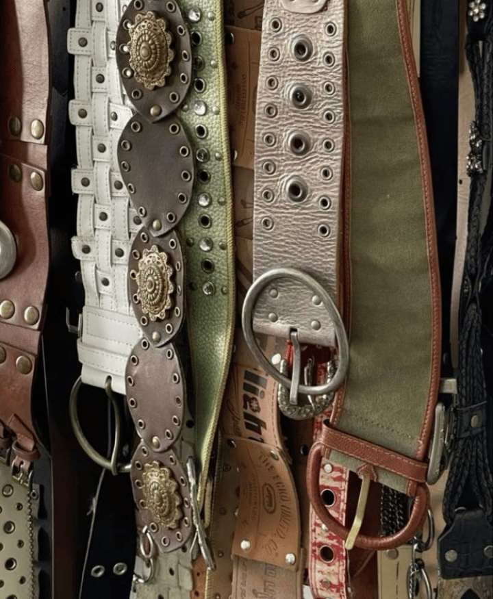 Collection of leather belts with metal buckles in various designs for fashion accessories