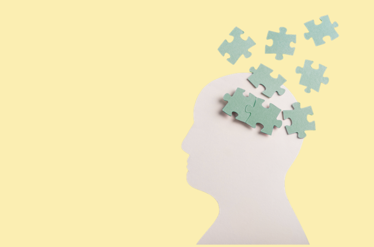 Human head with puzzle pieces
