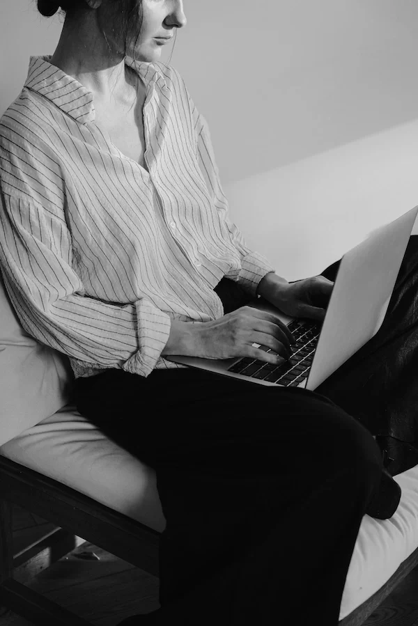 Woman working on a laptop, representing growth marketing services at Well & Wise Media Co.. Based in Salt Lake City, UT. Serving across U.S.