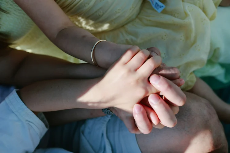 Hands joined together in support