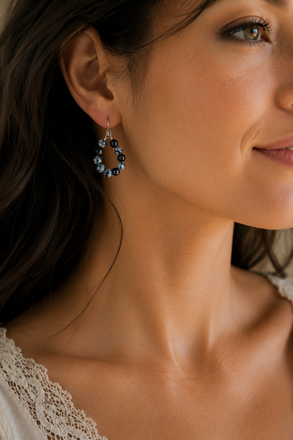 Closeup of Woman- Snowflake Obsidian Earrings.png
