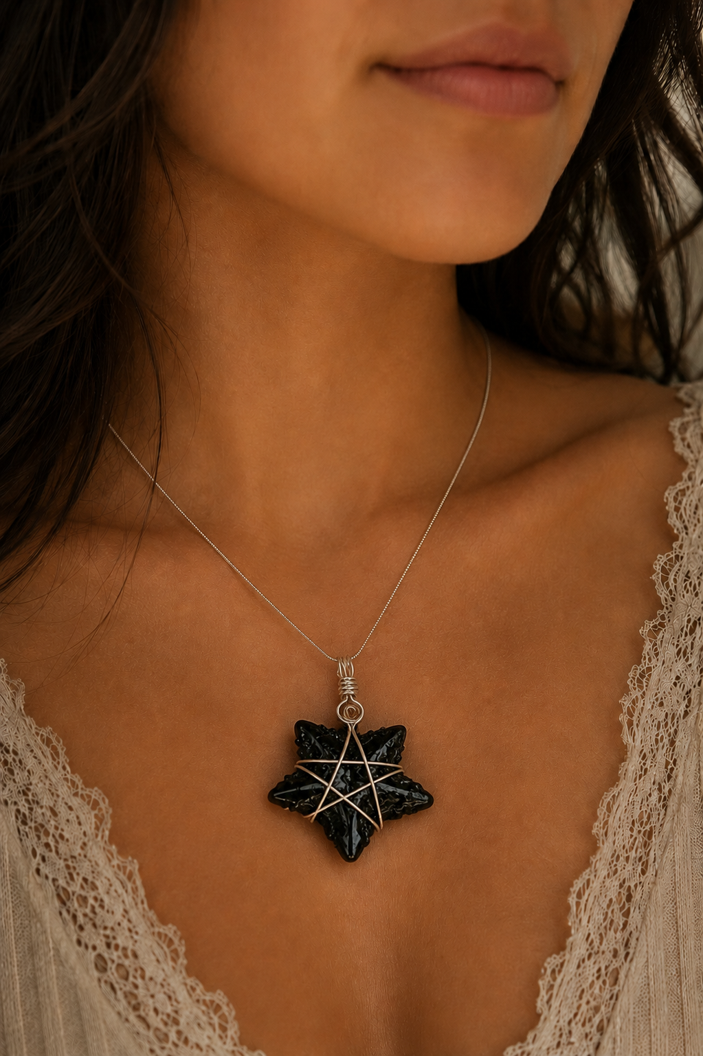 Closeup of Woman wearing Obsidian Star Necklace.png