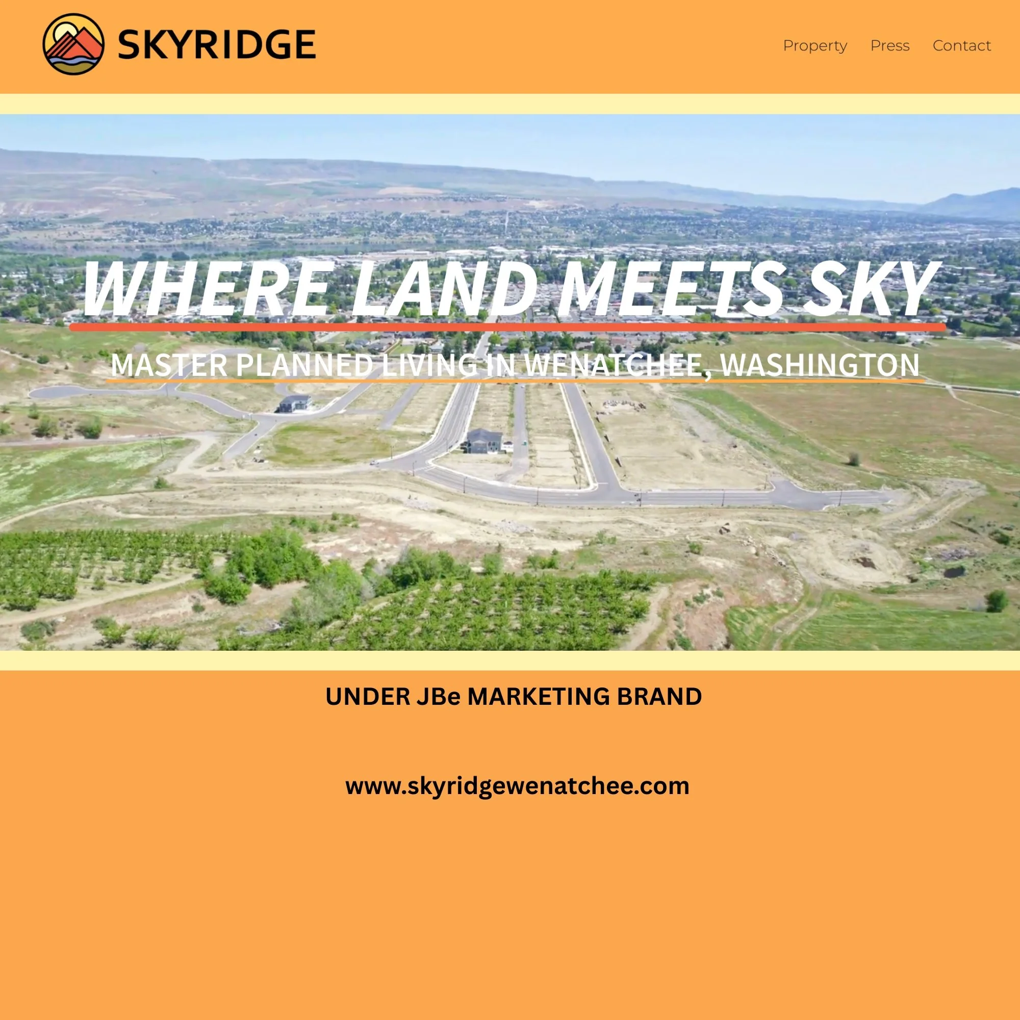 Aerial view of a new housing development under construction in Wenatchee, Washington, with vacant lots and roads, alongside green farmland and hills in the background, displayed on a website for Skyridge.