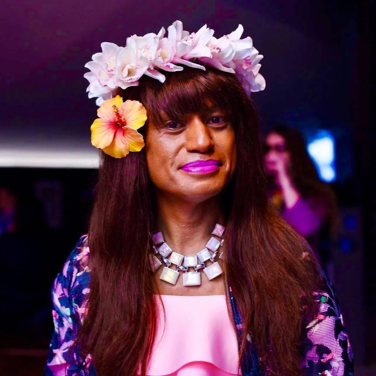 A smiling Amao Leota Tu from the shoulders up.