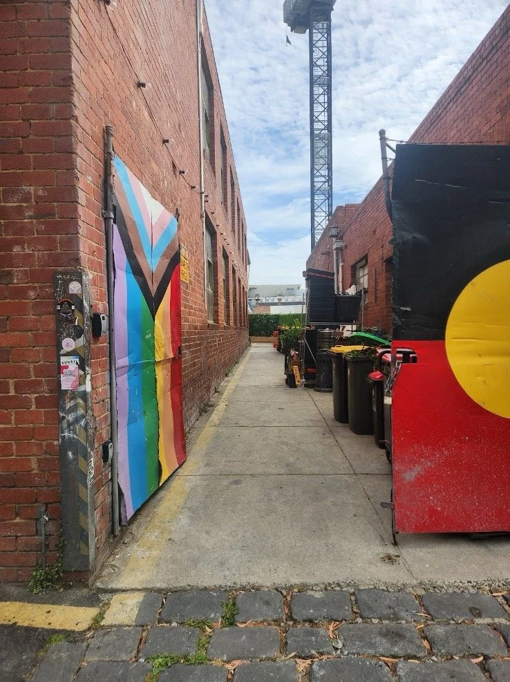 A footpath down a laneway to the step-free side entrance of Studio Take Care