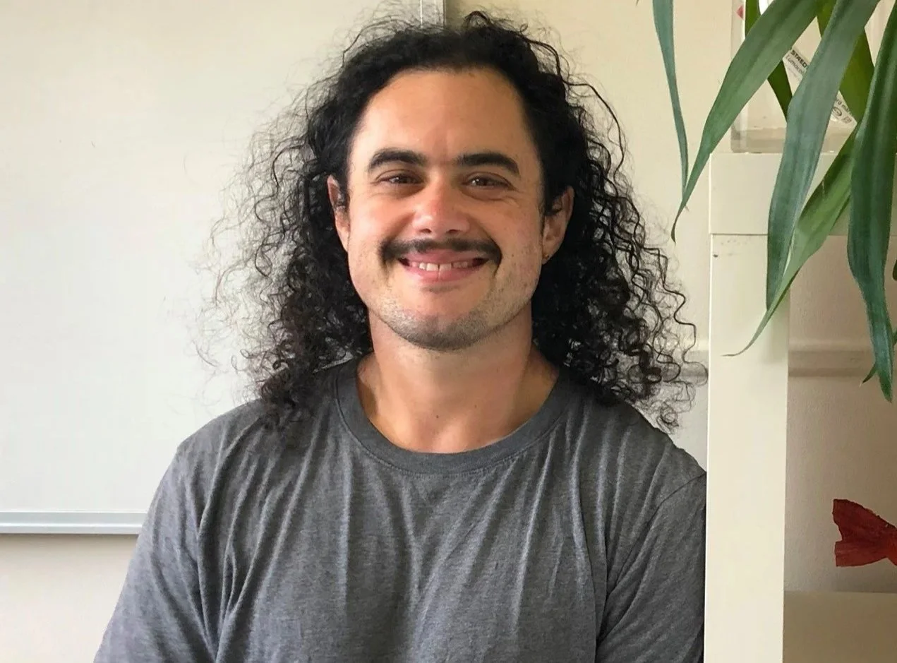 A smiling Arlie Alizzi from the shoulders up.