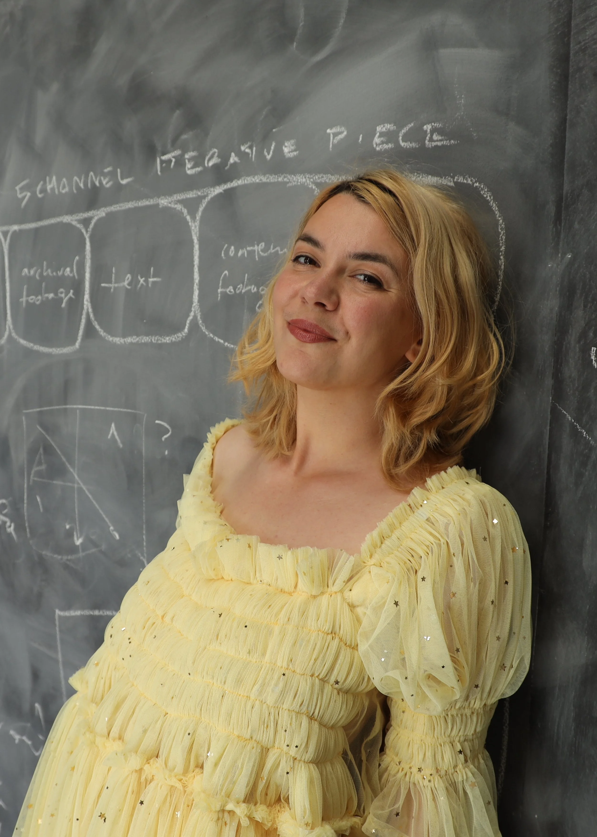 A smiling Jazz Money from the shoulders up. 