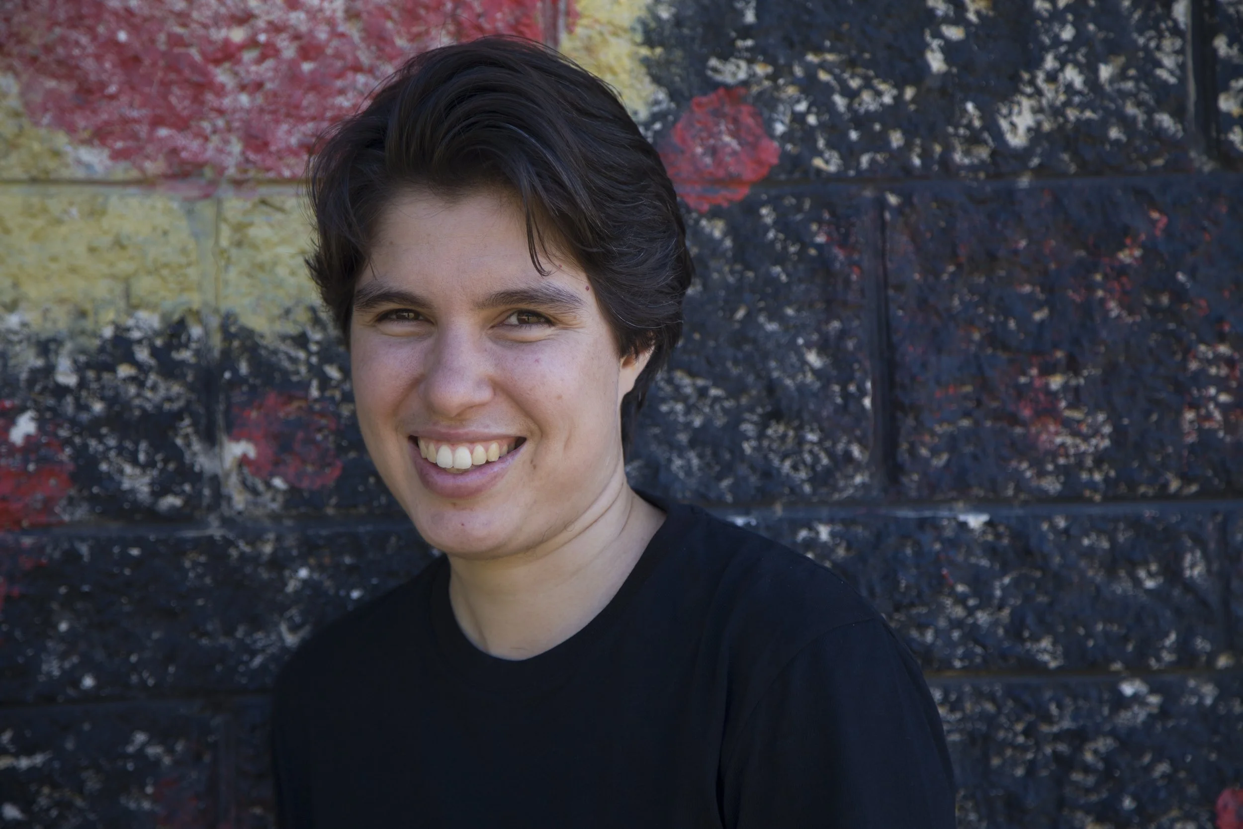 The face of a smiling Ellen van Neerven.