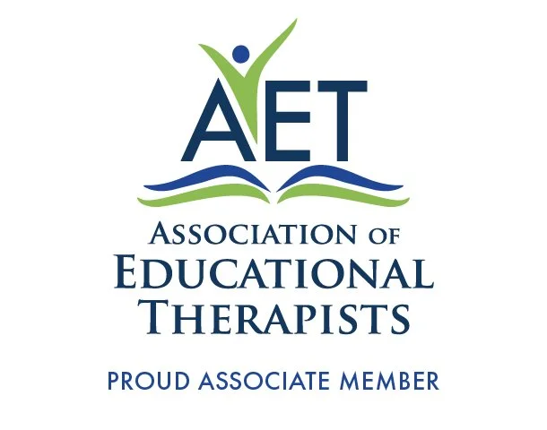 Logo for the Association of Educational Therapists featuring a stylized figure with a green and blue design, and an open book beneath the text.