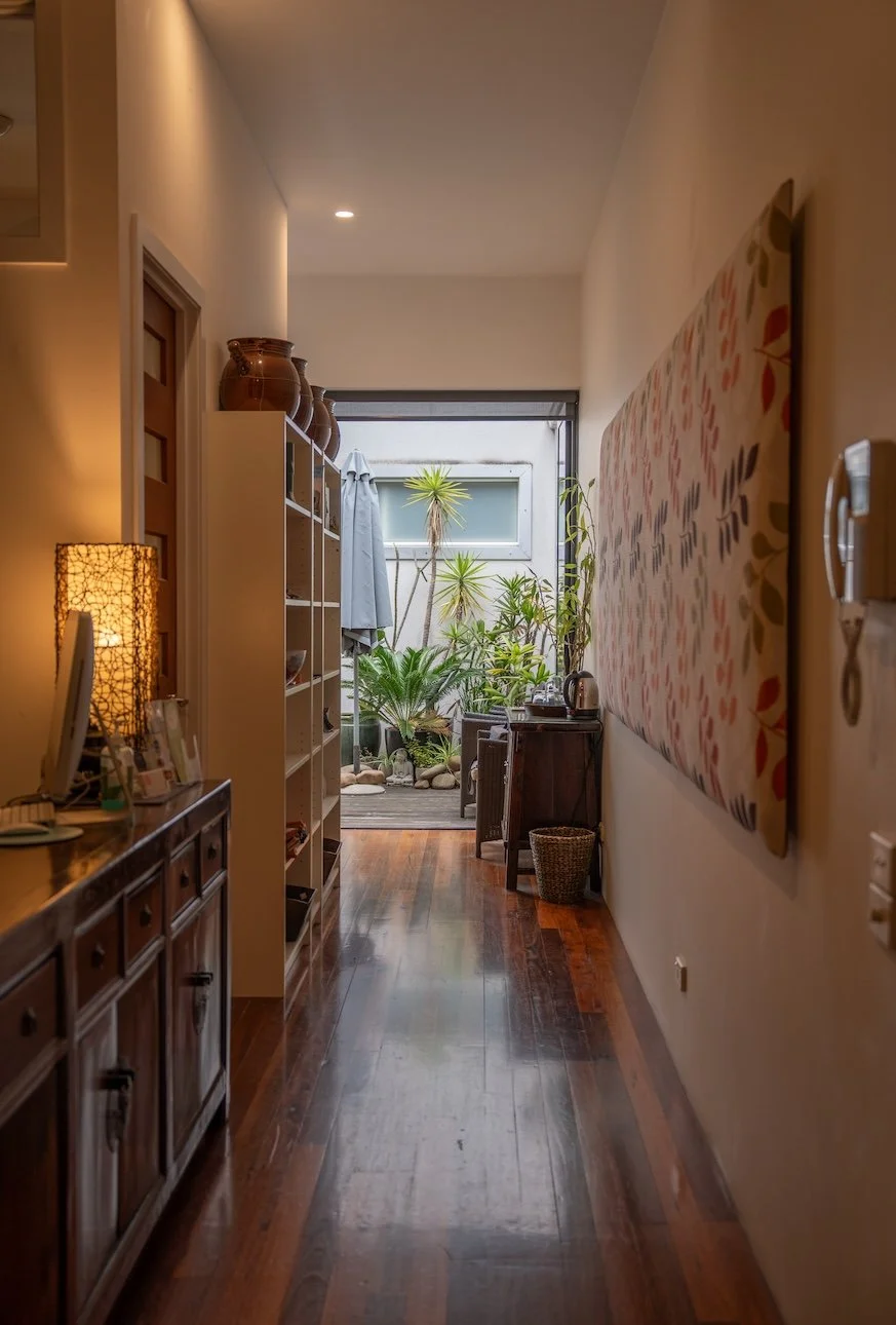 Light-filled hallway to garden patio at Port Melbourne Traditional Chinese Medicine clinic in Port Melbourne, tranquil wellness setting.