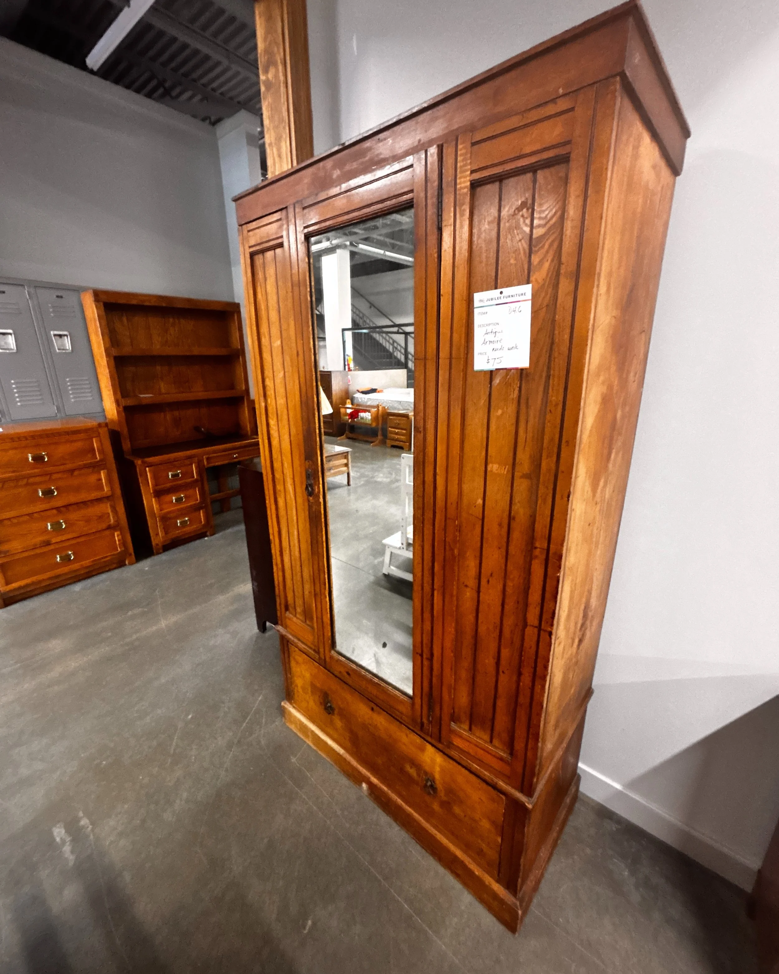 Restorer&rsquo;s dream

This antique wardrobe has incredible character and timeless craftsmanship just waiting to be brought back to life. Featuring mirrored doors, paneled wood detailing, and lower storage drawers, this piece has the potential to be