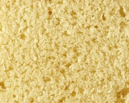 Close-up of a golden yellow sponge cake surface